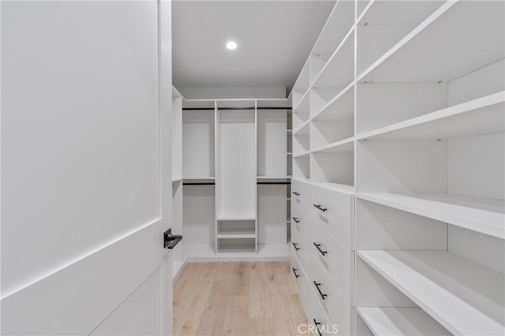 7435 Ranchito Avenue Van Nuys, CA 91405 - Photo 9 of 16 a view of walk in closet with empty racks