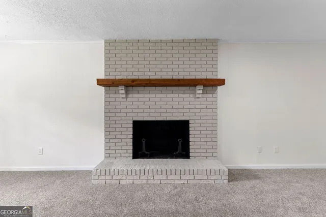 a living room with a fireplace