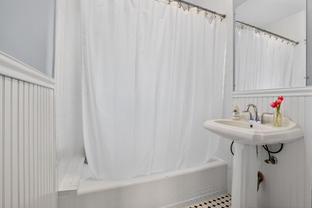 15 Kingsboro Park, Unit 2 Boston, MA 02130 - Photo 19 of 30 a bathroom with a sink and a shower curtain