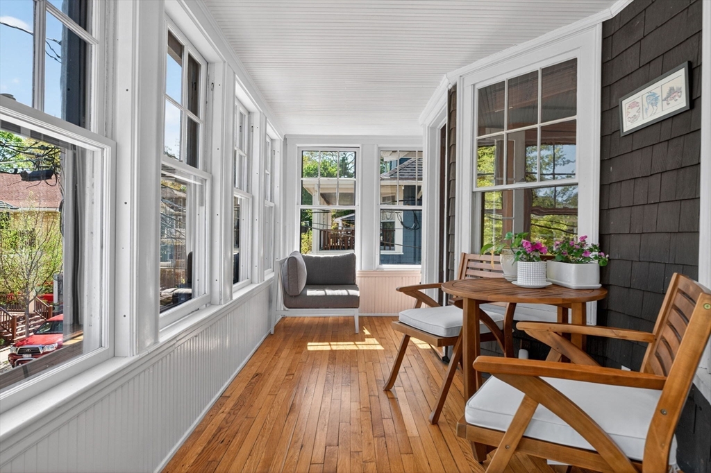 15 Kingsboro Park, Unit 2 Boston, MA 02130 - Photo 7 of 30 a balcony with chairs and wooden floor