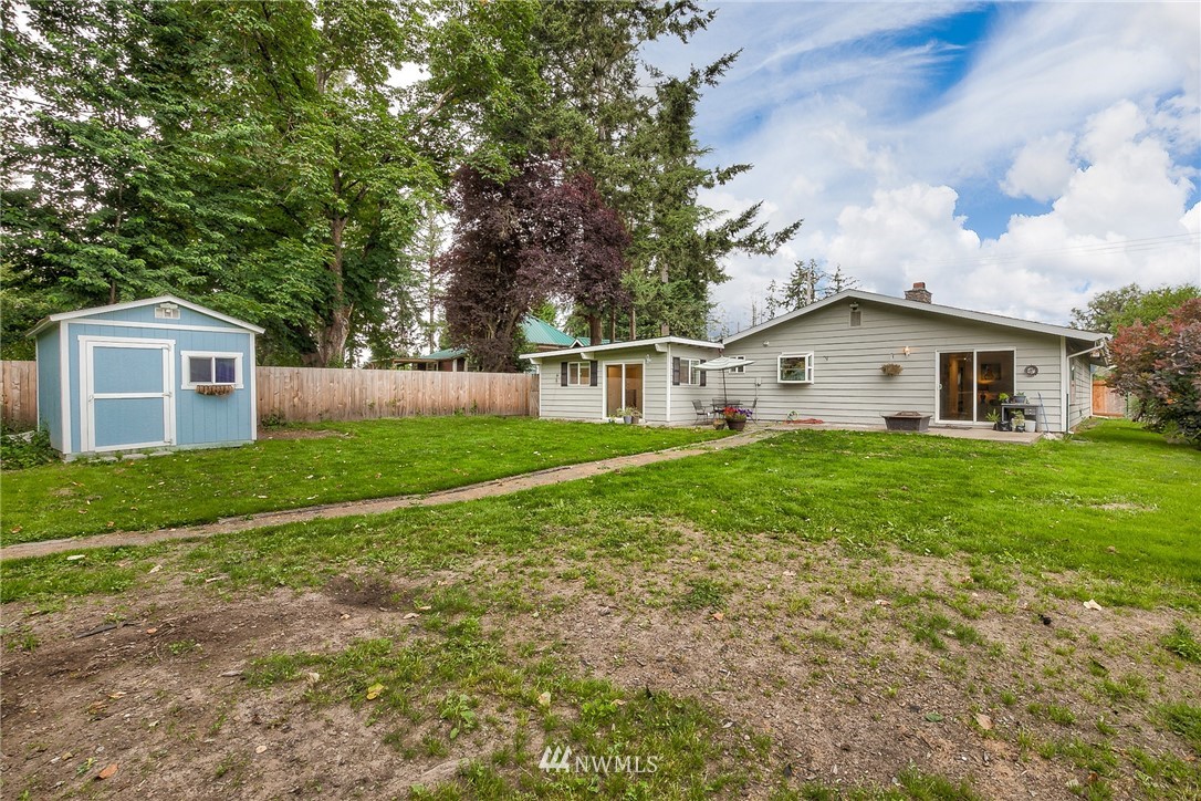 7484 Riverside Drive East Sumner, WA 98390 - Photo 17 of 23 a view of house with yard and green space