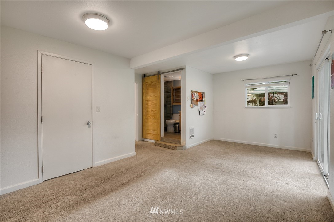 7484 Riverside Drive East Sumner, WA 98390 - Photo 9 of 23 an empty room with entrance and windows