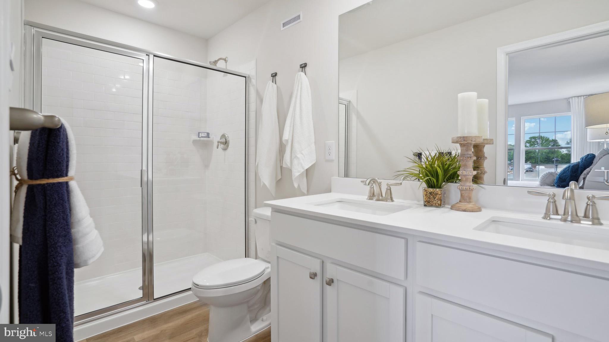 73 Alexander Way Westampton, NJ 08060 - Photo 19 of 28 a bathroom with a sink a toilet and shower