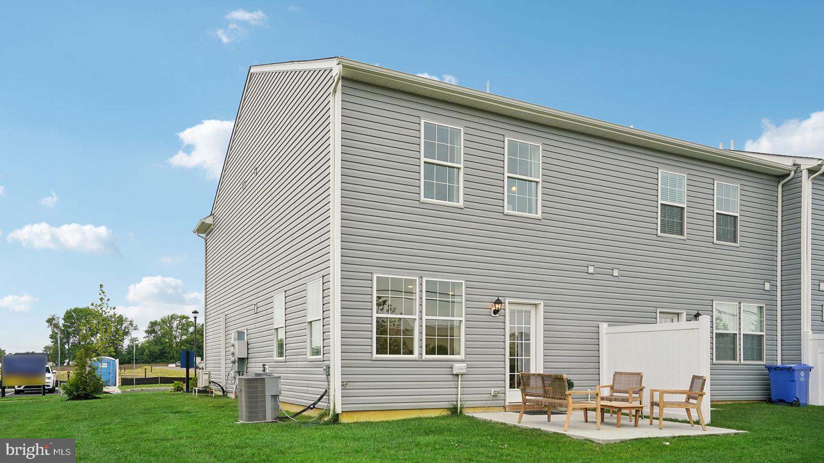 73 Alexander Way Westampton, NJ 08060 - Photo 26 of 28 a front view of a house with a garden and chairs