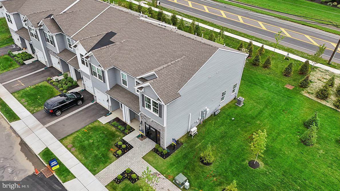 73 Alexander Way Westampton, NJ 08060 - Photo 27 of 28 a aerial view of a house with a big yard and potted plants