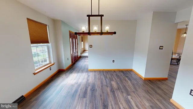 a kitchen with granite countertop a sink cabinets and stainless steel appliances