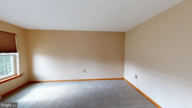 a kitchen with stainless steel appliances granite countertop a stove top oven a sink dishwasher a dining table and chairs with wooden floor