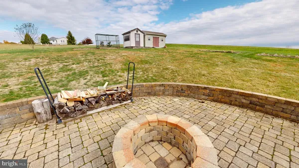 a bathroom with a granite countertop shower and a sink