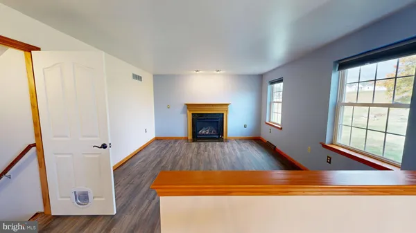 a view of room with window and ceiling fan