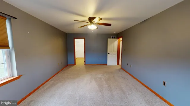 a view of a room with wooden walls