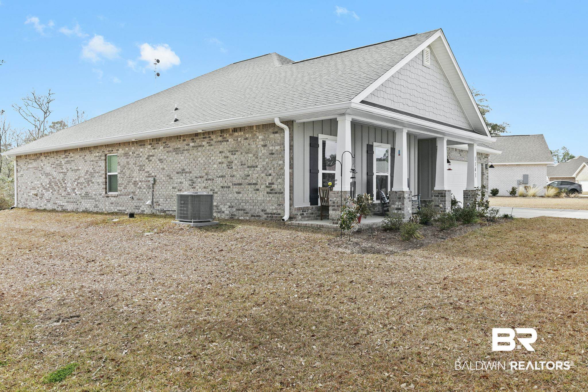 1141 Pencarro Boulevard Foley, AL 36535 - Photo 56 of 70 View of property exterior featuring central AC unit