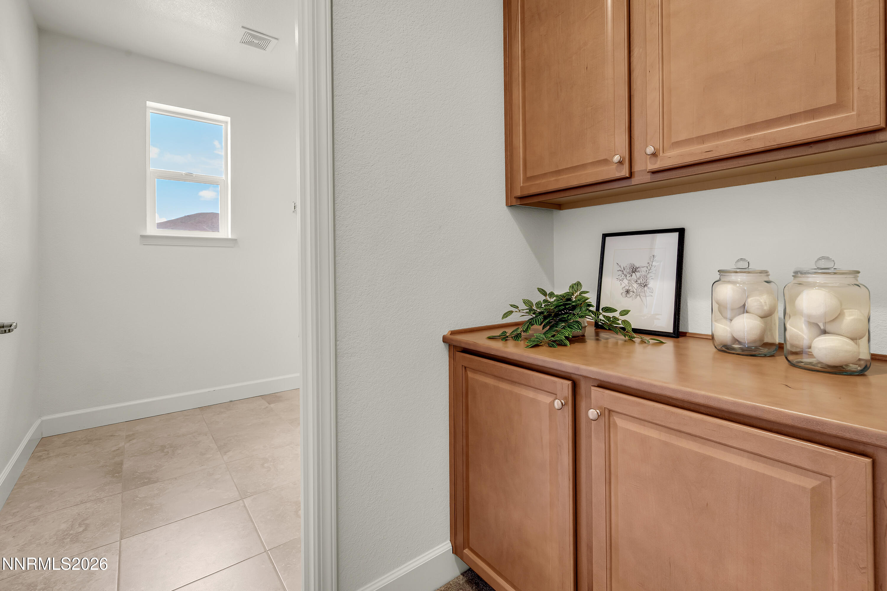 10150 Barrel Racer Drive Reno, NV 89521 - Photo 45 of 64 a kitchen with stainless steel appliances granite countertop a sink and cabinets