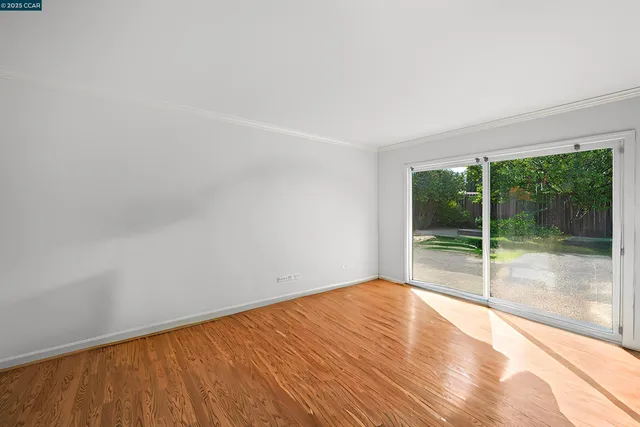 a front view of a house with a garden and entryway