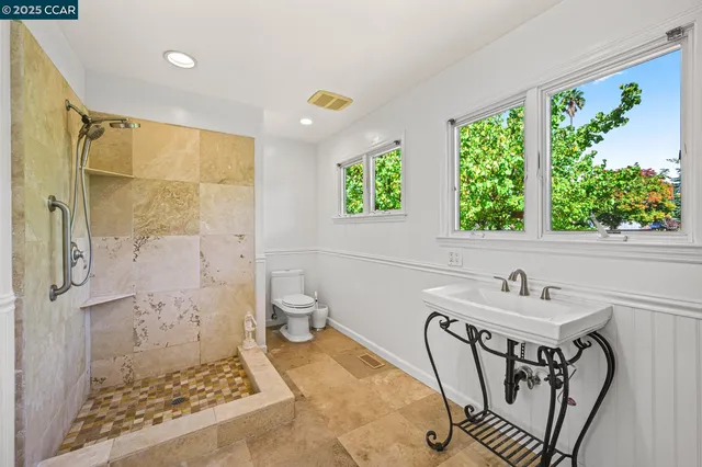 a view of a chairs and table in a garden