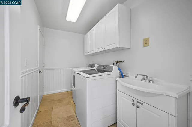 an aerial view of a house with a garden and trees
