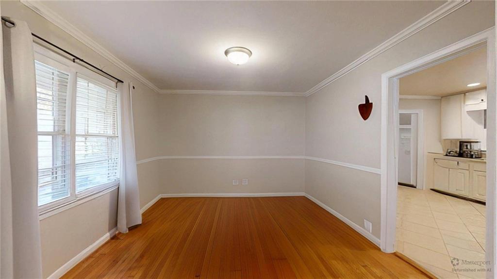 1838 Bruce Road Northeast Atlanta, GA 30329 - Photo 11 of 59 wooden floor in an empty room with a window