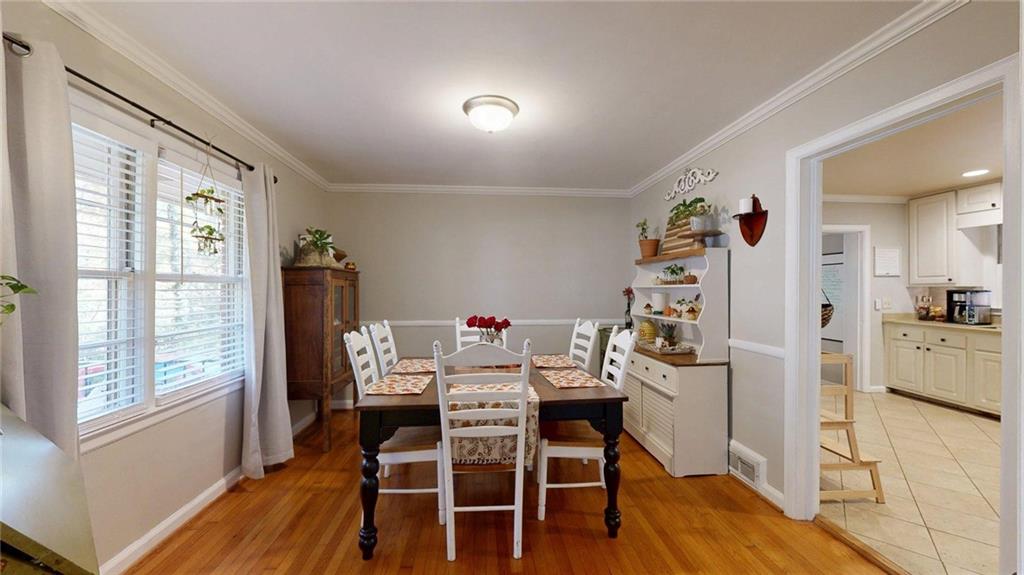 1838 Bruce Road Northeast Atlanta, GA 30329 - Photo 12 of 59 a view of a dining room with furniture and wooden floor
