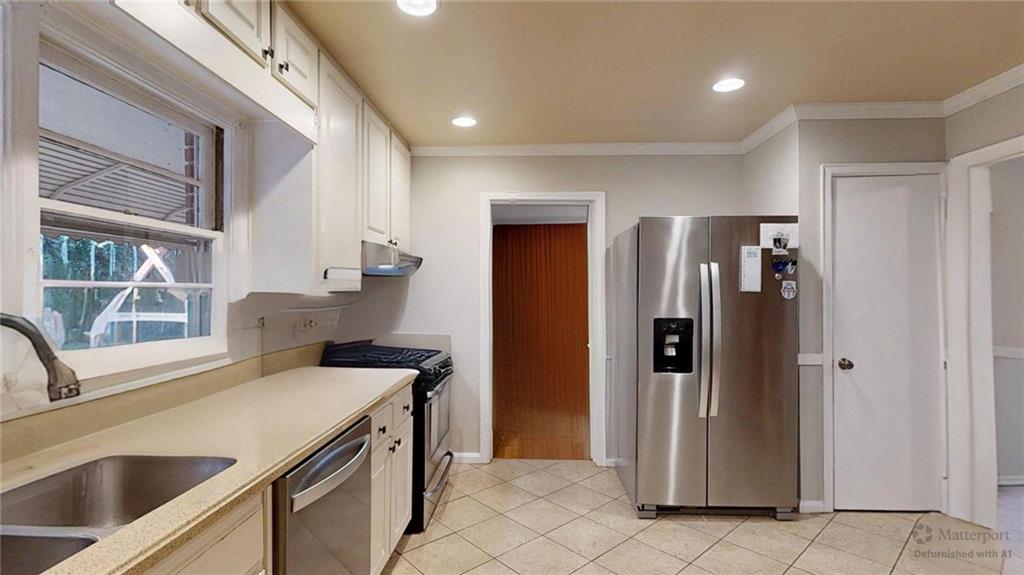 1838 Bruce Road Northeast Atlanta, GA 30329 - Photo 22 of 59 a kitchen that has a sink a refrigerator and window