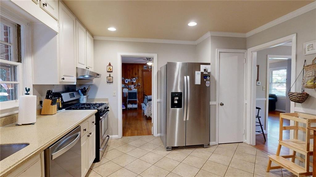 1838 Bruce Road Northeast Atlanta, GA 30329 - Photo 23 of 59 a kitchen with stainless steel appliances a refrigerator and a stove