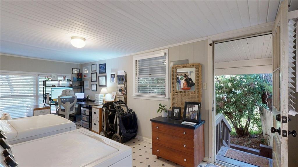 1838 Bruce Road Northeast Atlanta, GA 30329 - Photo 24 of 59 a view of a workspace with furniture and a window
