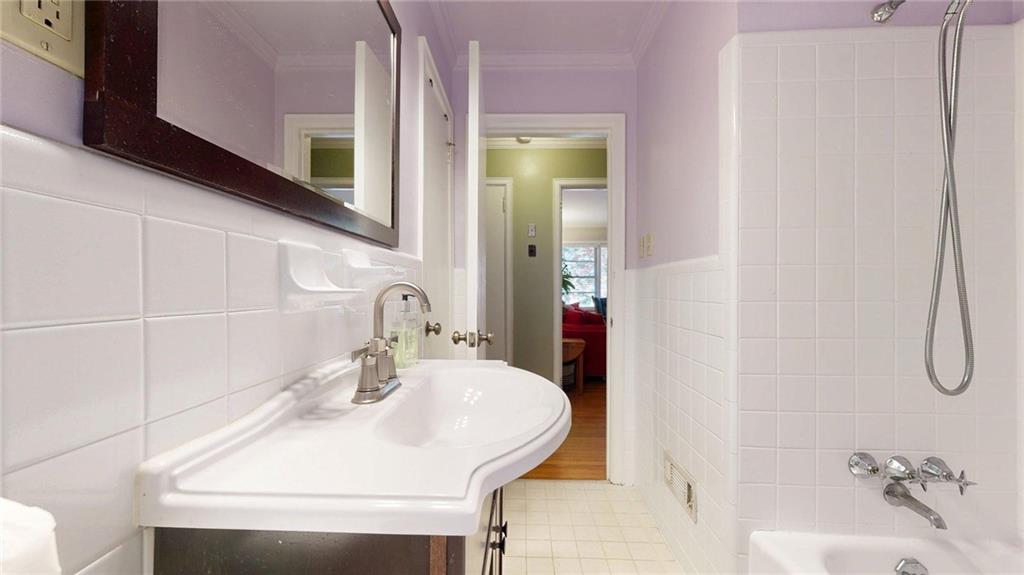 1838 Bruce Road Northeast Atlanta, GA 30329 - Photo 33 of 59 a bathroom with a sink and a mirror