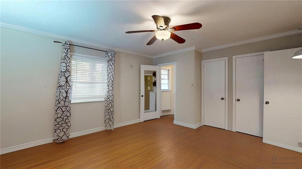 1838 Bruce Road Northeast Atlanta, GA 30329 - Photo 36 of 59 a view of empty room with wooden floor and fan