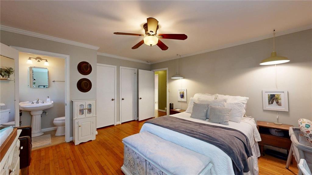 1838 Bruce Road Northeast Atlanta, GA 30329 - Photo 38 of 59 a bedroom with a bed and a chandelier