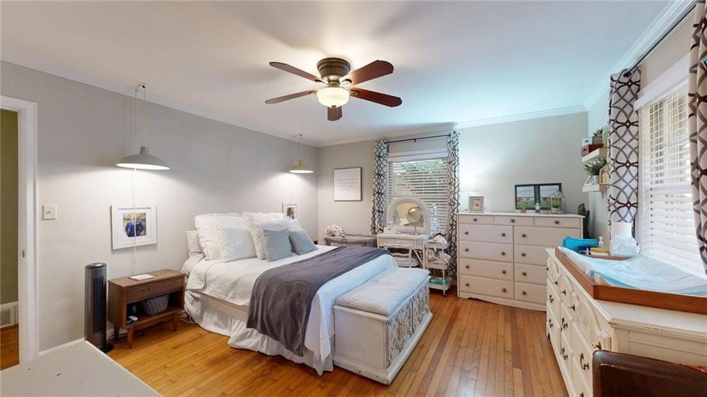 1838 Bruce Road Northeast Atlanta, GA 30329 - Photo 39 of 59 a bedroom with a bed and a chandelier