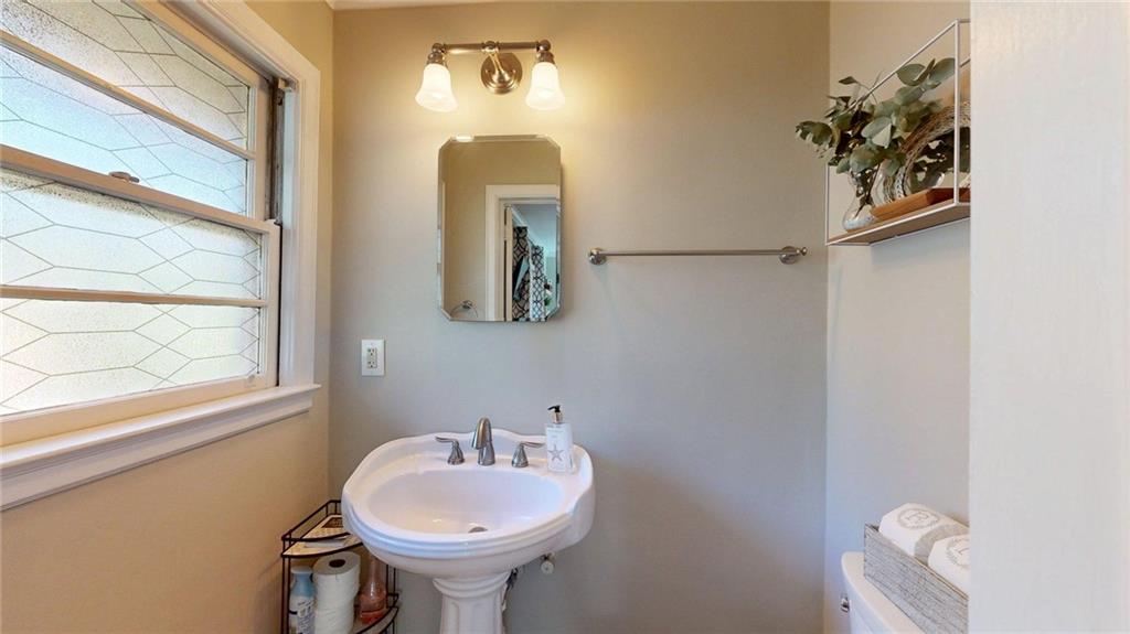 1838 Bruce Road Northeast Atlanta, GA 30329 - Photo 40 of 59 a bathroom with a sink mirror and toilet