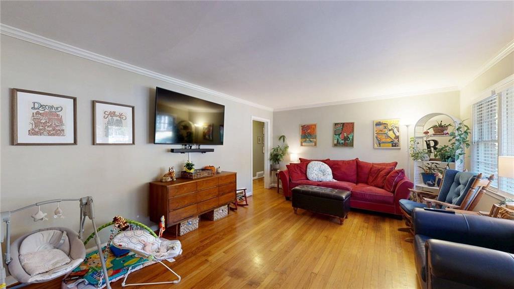 1838 Bruce Road Northeast Atlanta, GA 30329 - Photo 4 of 59 a living room with furniture and a flat screen tv