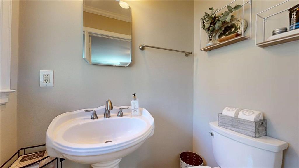 1838 Bruce Road Northeast Atlanta, GA 30329 - Photo 41 of 59 a bathroom with a toilet and sink