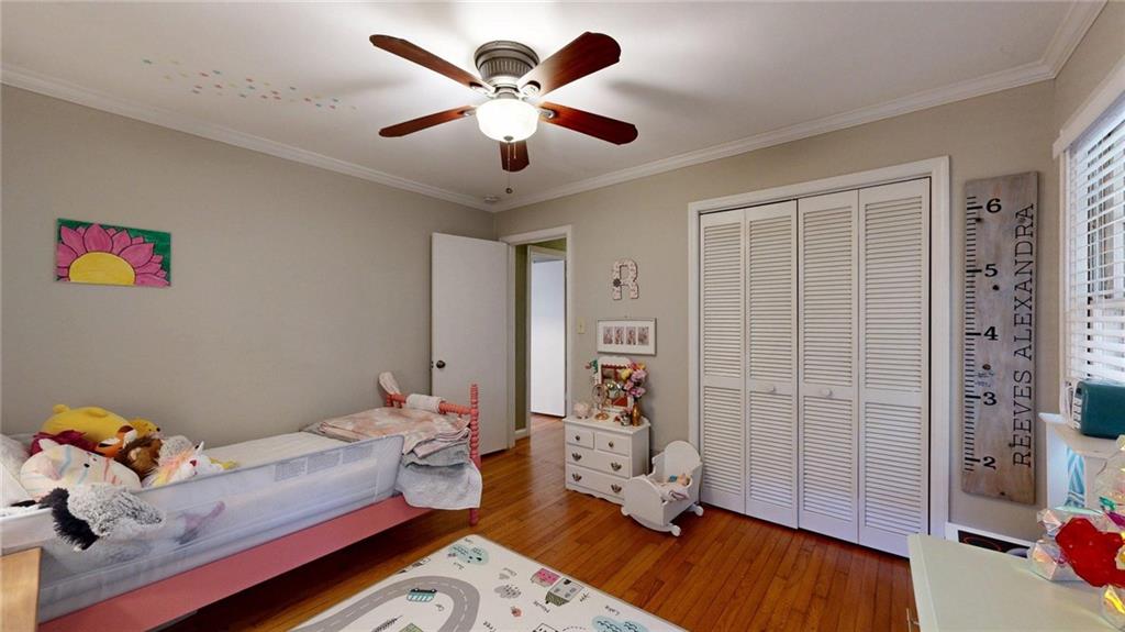 1838 Bruce Road Northeast Atlanta, GA 30329 - Photo 44 of 59 a living room with furniture and a wooden floor