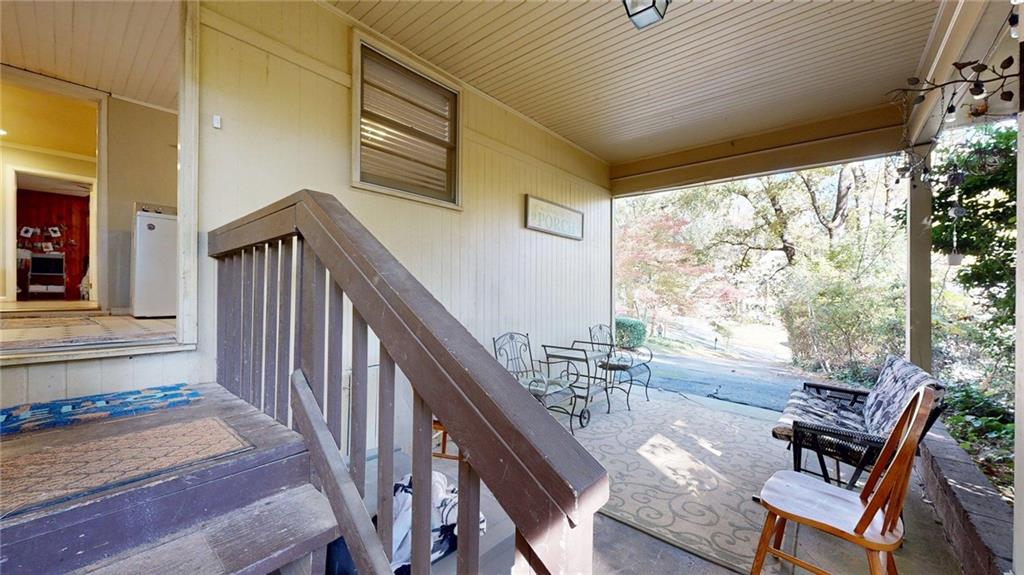 1838 Bruce Road Northeast Atlanta, GA 30329 - Photo 46 of 59 a view of a porch with furniture and wooden deck