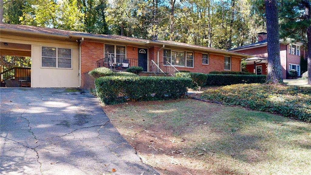1838 Bruce Road Northeast Atlanta, GA 30329 - Photo 49 of 59 a front view of a house with a yard