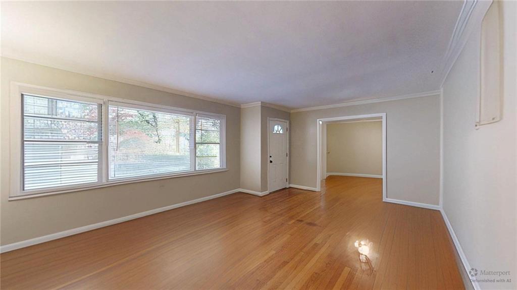 1838 Bruce Road Northeast Atlanta, GA 30329 - Photo 7 of 59 an empty room with wooden floor and windows