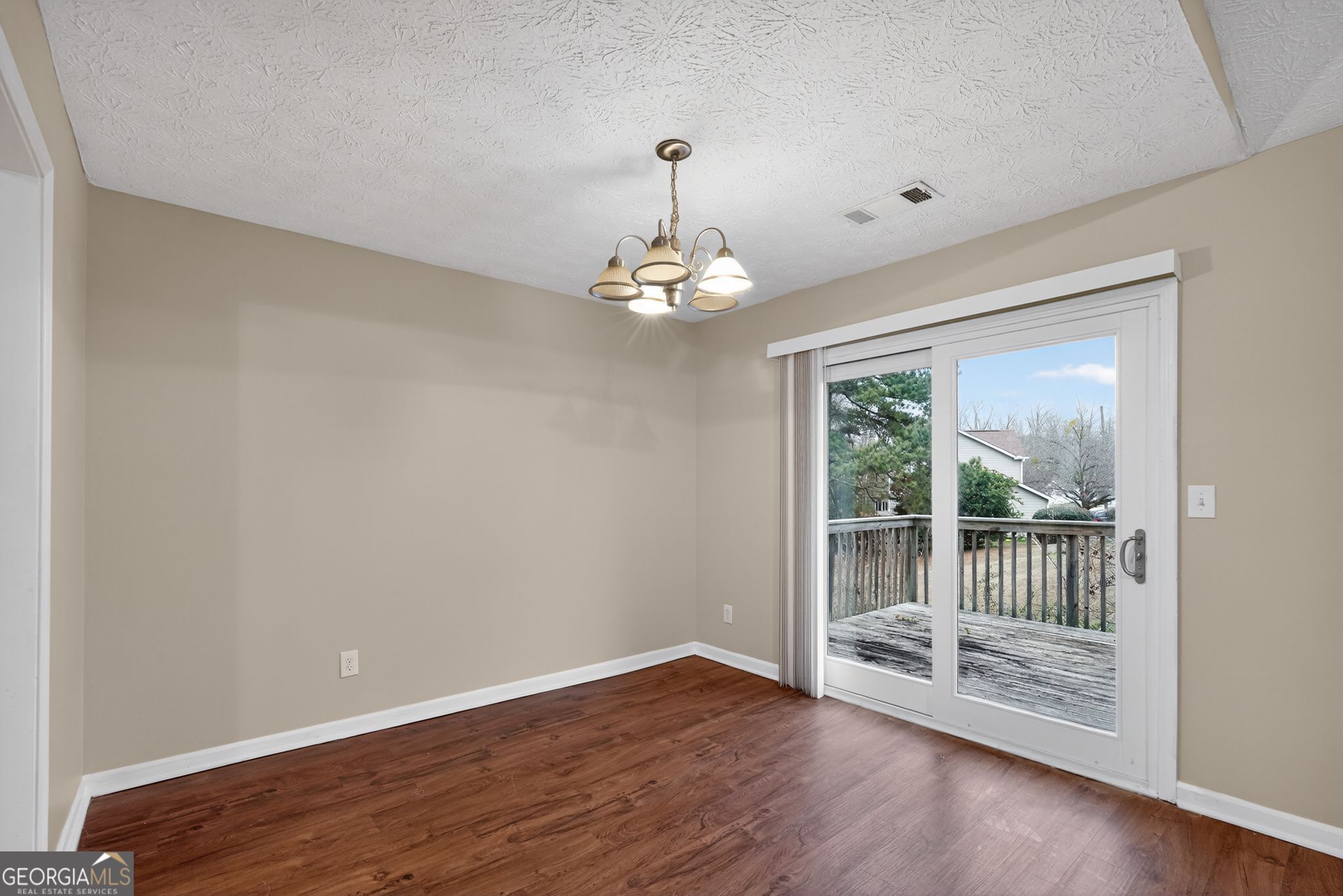 205 Whirlwind Court Atlanta, GA 30349 - Photo 17 of 32 a view of a room with wooden floor and large window