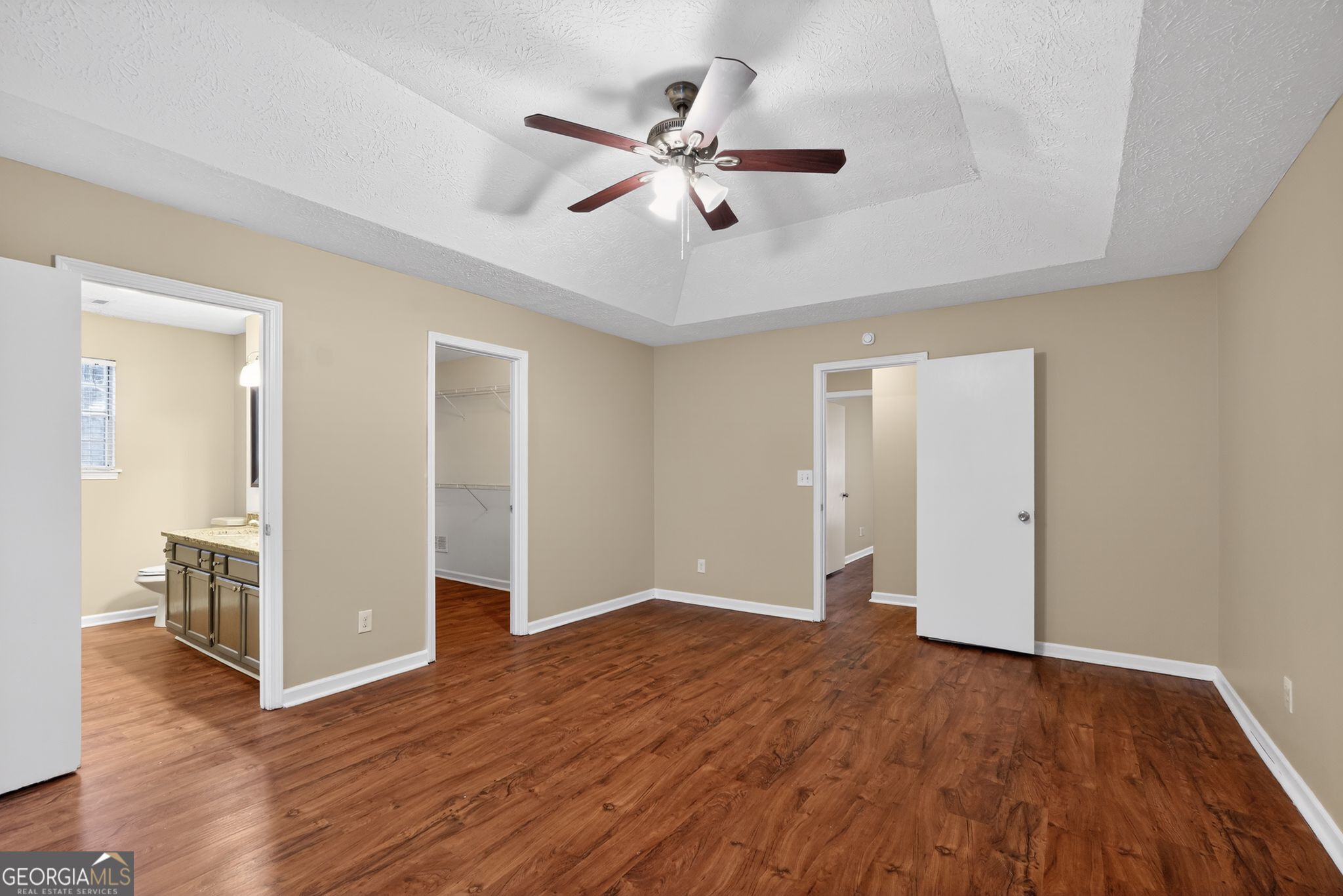 205 Whirlwind Court Atlanta, GA 30349 - Photo 23 of 32 a view of an empty room with wooden floor