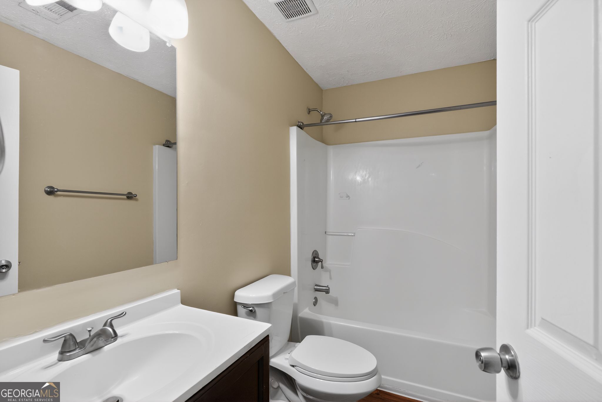 205 Whirlwind Court Atlanta, GA 30349 - Photo 25 of 32 a bathroom with a sink toilet and shower