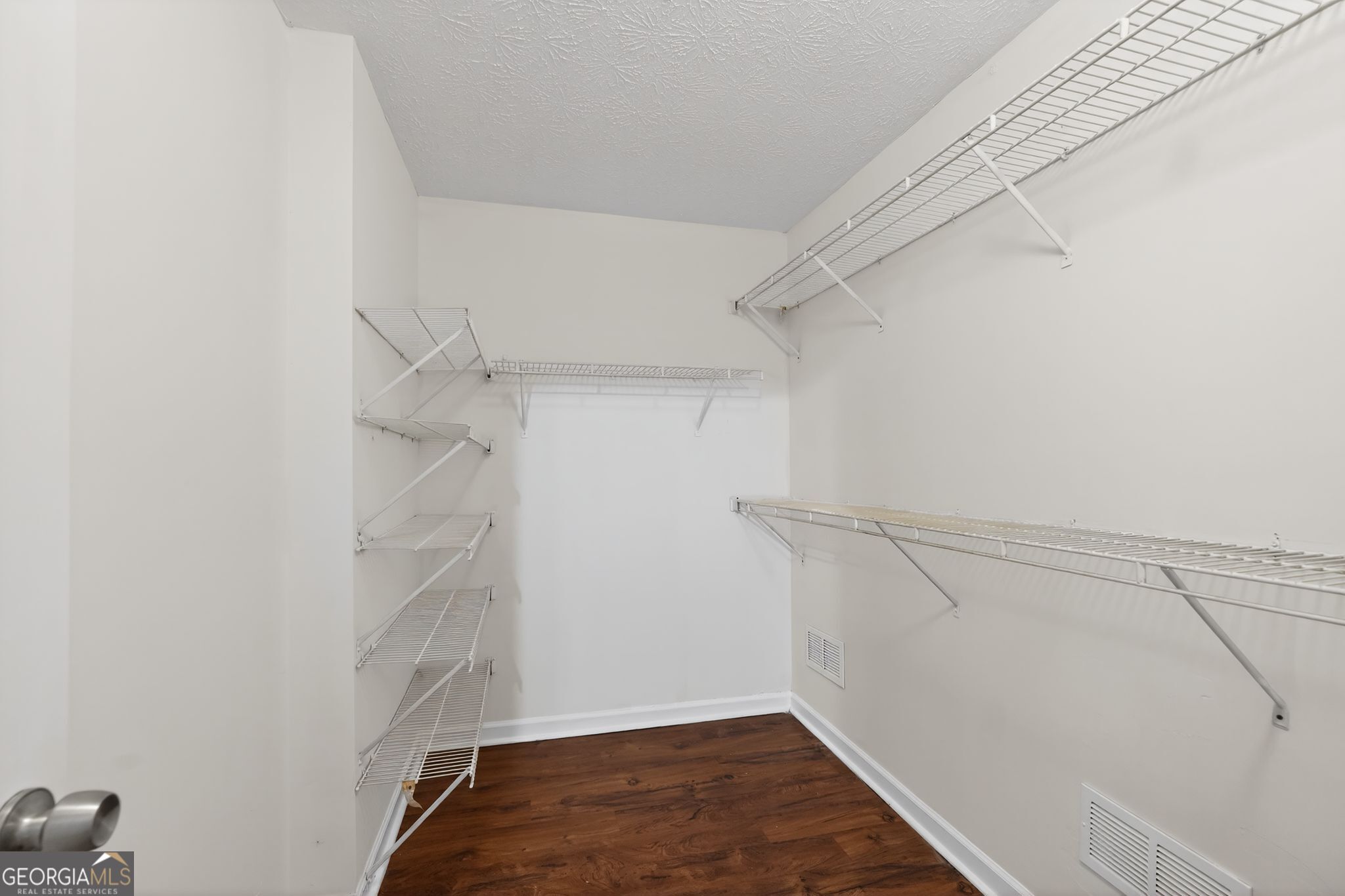 205 Whirlwind Court Atlanta, GA 30349 - Photo 29 of 32 a view of a room with racks on the wall