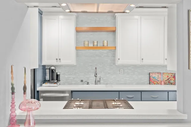 a bathroom with a sink vanity mirror and toilet