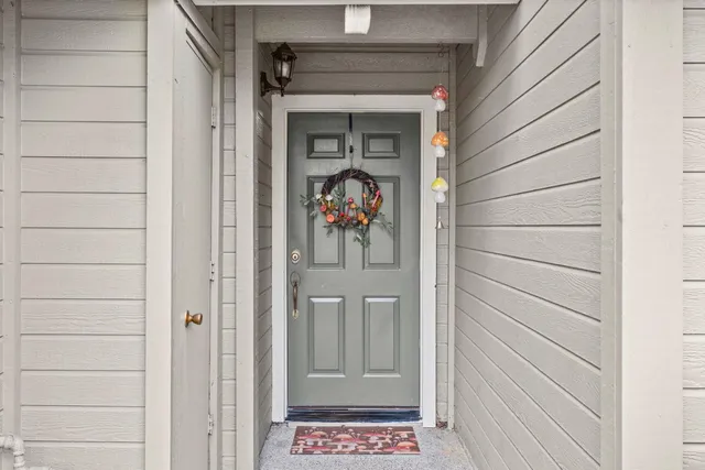 a view of a entryway door front of a house