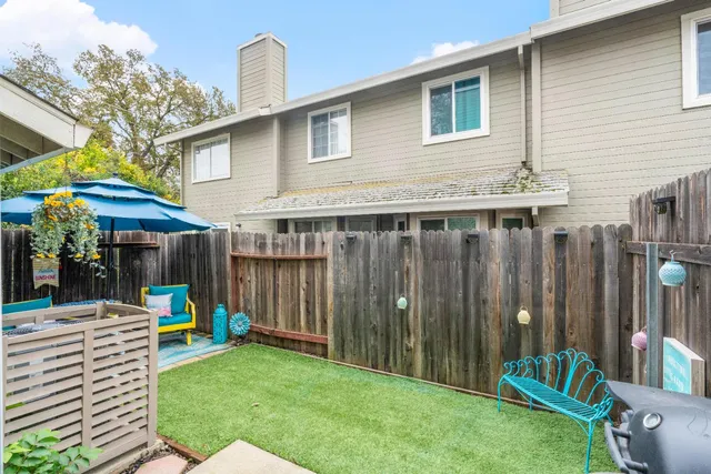 an aerial view of a house a yard and garden
