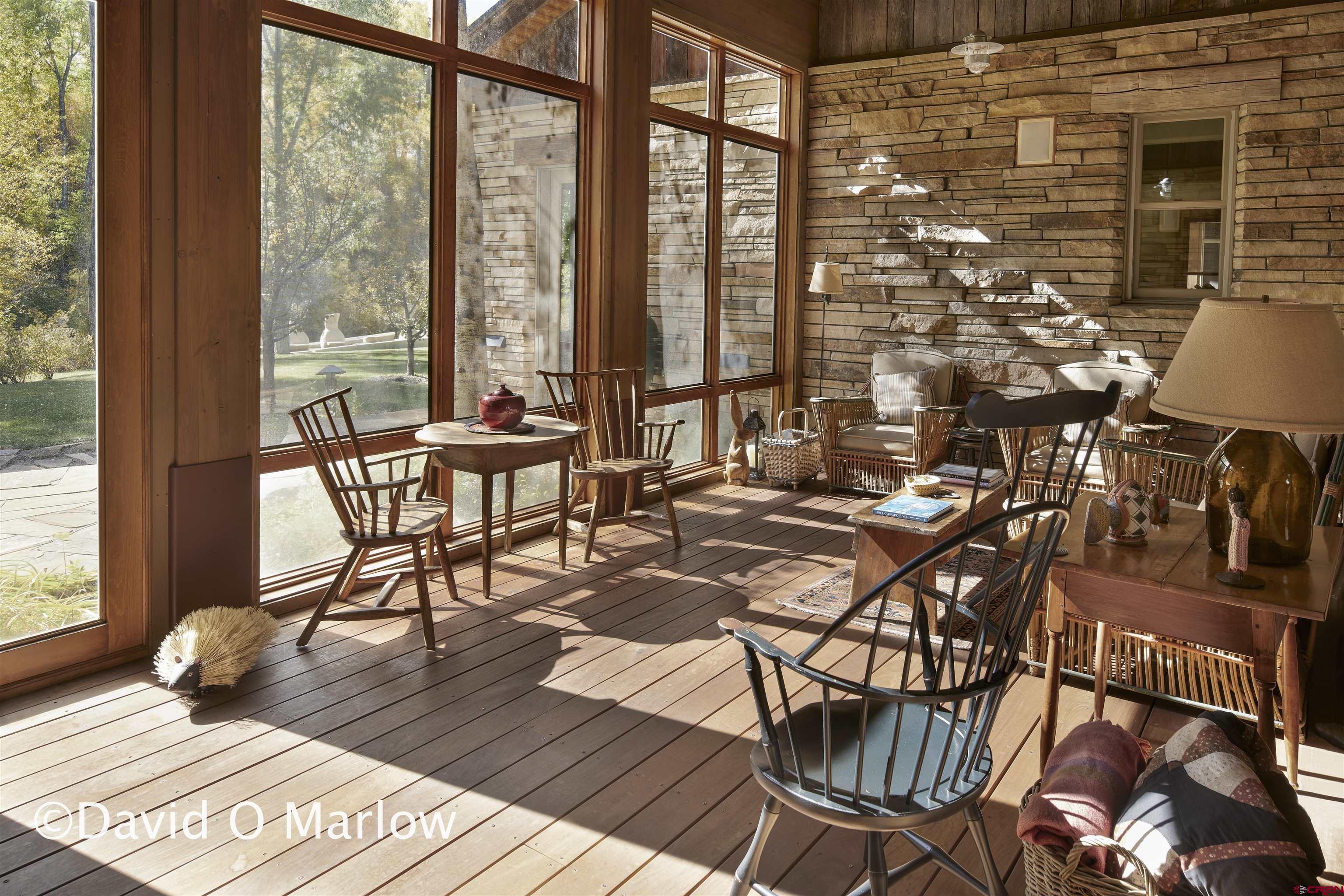 505 Eagle Creek Road Gunnison, CO 81230 - Photo 11 of 45 a view of a dining room with furniture and wooden floor