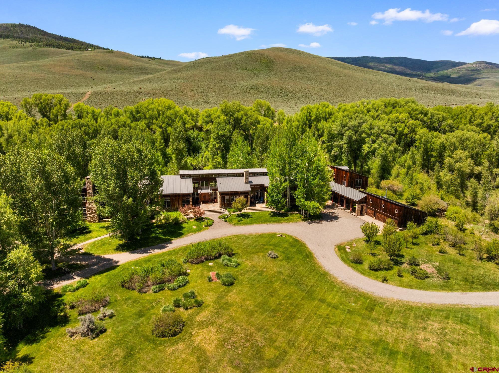 505 Eagle Creek Road Gunnison, CO 81230 - Photo 2 of 45 a view of a swimming pool with a garden