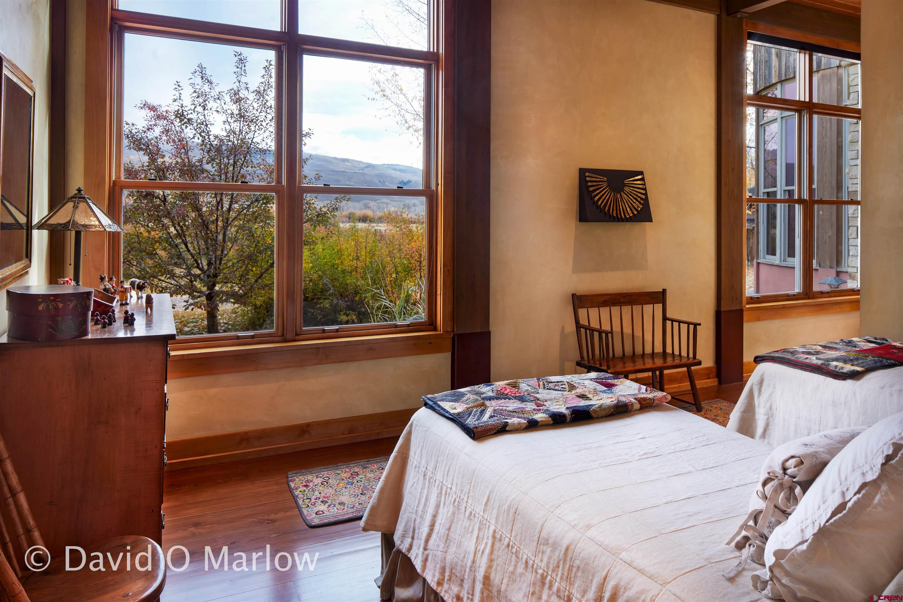 505 Eagle Creek Road Gunnison, CO 81230 - Photo 24 of 45 a bedroom with a bed and a window