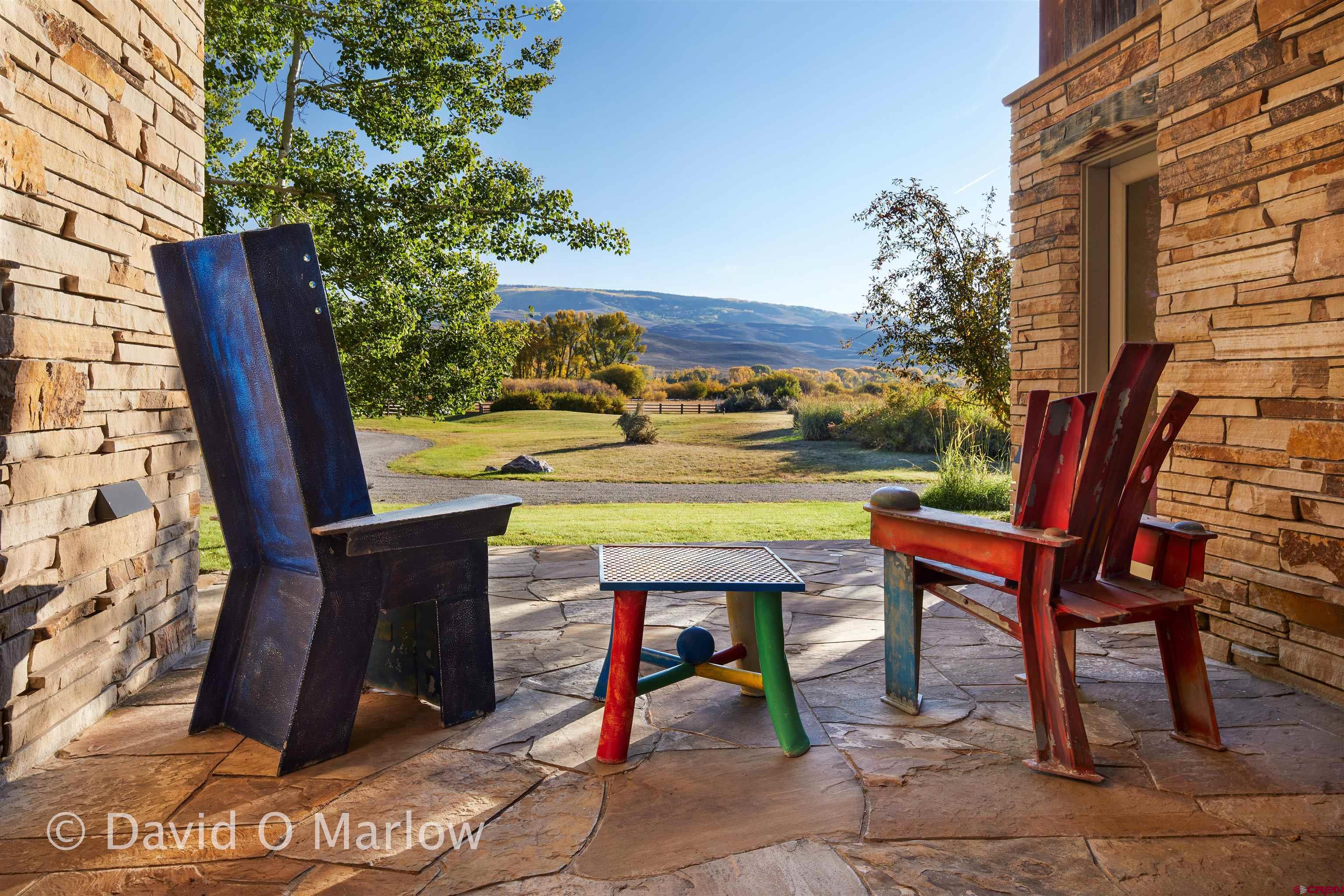 505 Eagle Creek Road Gunnison, CO 81230 - Photo 34 of 45 a view of a chairs and table in the patio