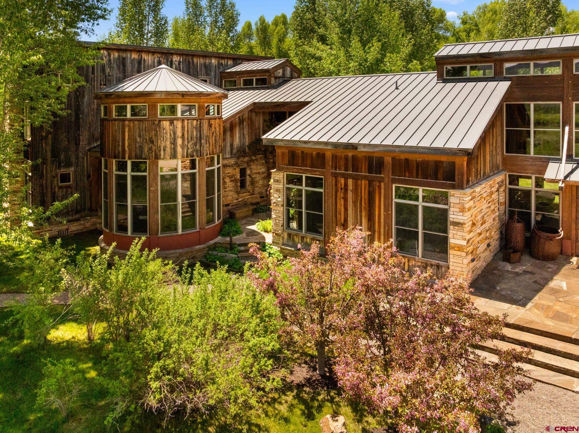 505 Eagle Creek Road Gunnison, CO 81230 - Photo 5 of 45 a view of a house with a yard and potted plants