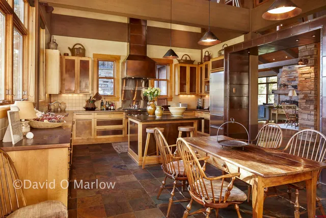 a dinning area with pool table and chairs