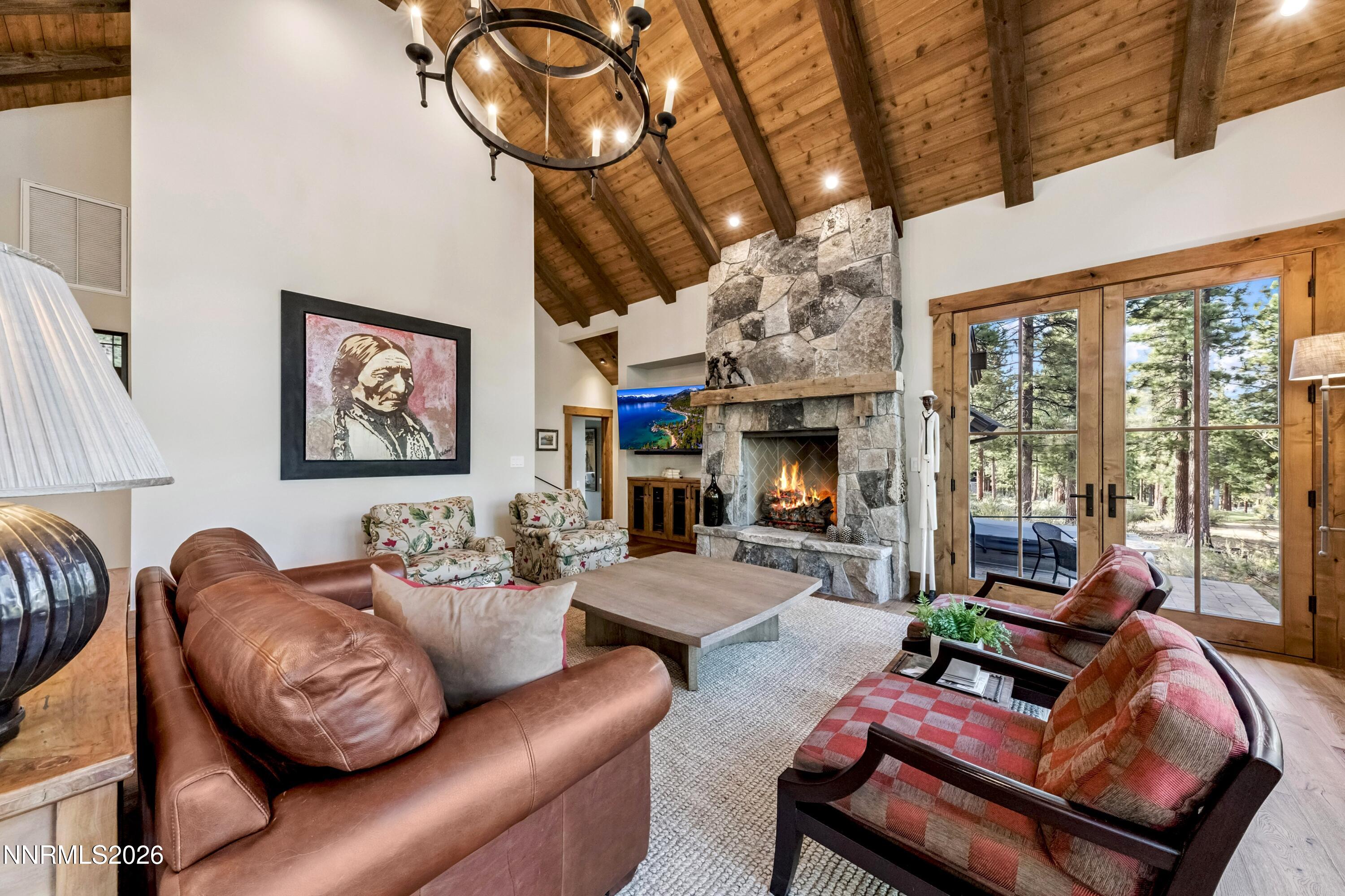 261 Redding Way Carson City, NV 89705 - Photo 12 of 90 a living room with furniture a fireplace and a large window