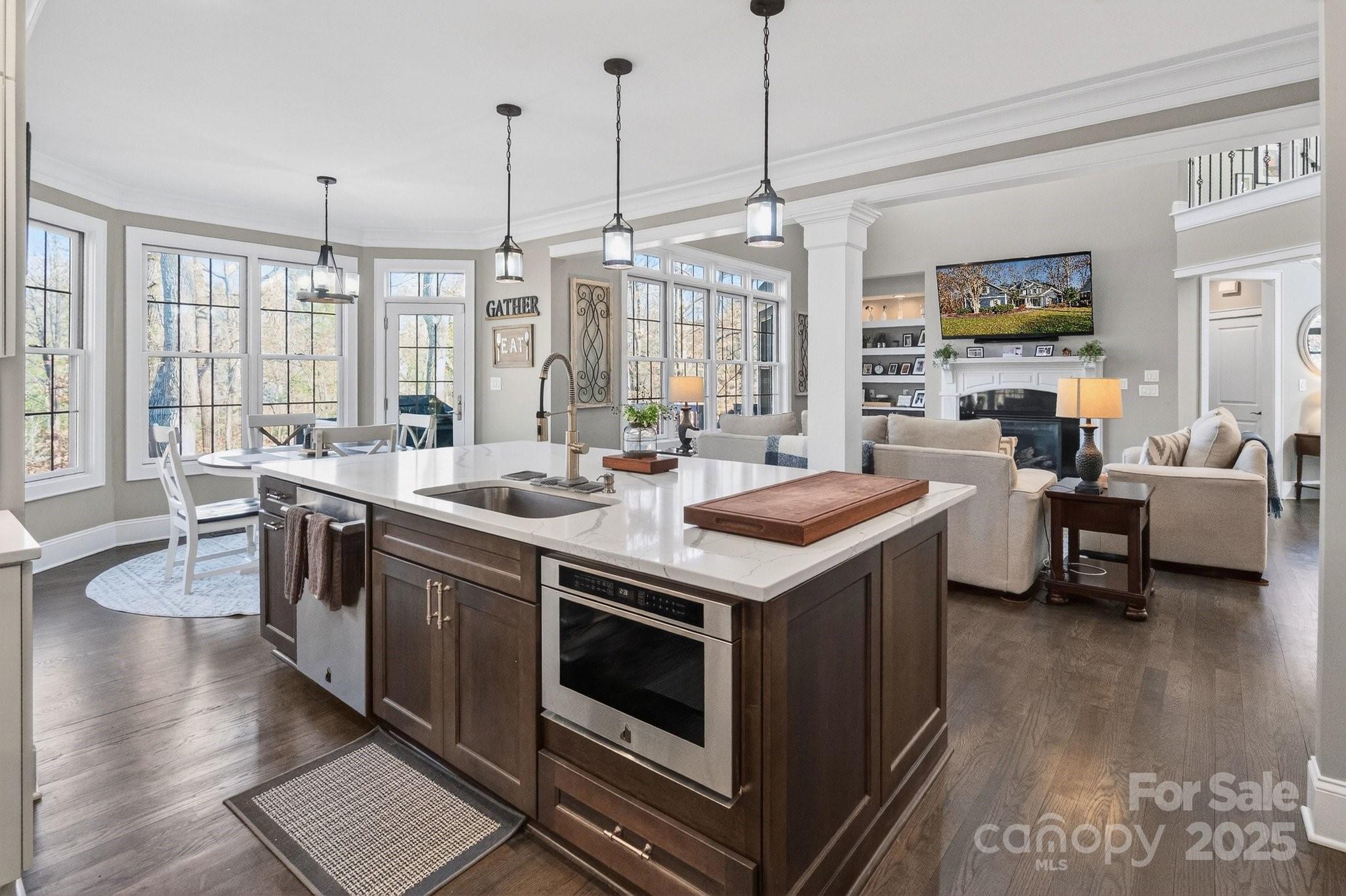 7653 Juniper Lane Denver, NC 28037 - Photo 14 of 43 a kitchen with stainless steel appliances granite countertop a stove and a sink